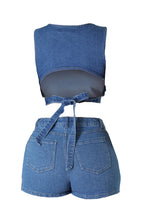 Load image into Gallery viewer, chic two-piece features a relaxed-fit denim pull over top with playful cutouts and high-waisted shorts