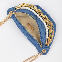 Load image into Gallery viewer, The clutch's standout design is accentuated by its layered multi-chain detailing, which adds a touch of modern elegance Dimensions:10"W x 5"H x 2.5"D Materials:Denim, Mixed Metal