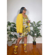 Load image into Gallery viewer, Back view of flower detailed midi dress with smooth floral finish and comfortable shape.