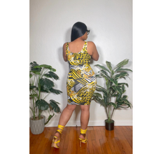 Load image into Gallery viewer, Hemline view of floral midi dress showing mid-length cut and soft draping fabric.