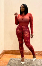 Load image into Gallery viewer, Styled red snake print leggings paired with crop top and sneakers for casual streetwear look.