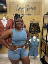 Load image into Gallery viewer, chic two-piece features a relaxed-fit denim pull over top with playful cutouts and high-waisted shorts
