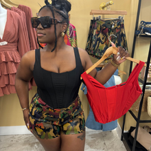 Load image into Gallery viewer, Side view of ChromaCamo high-waist shorts in multi-tone brown, red, green, black, and light brown camo print, stretchy and comfortable fit for casual or streetwear outfits.
