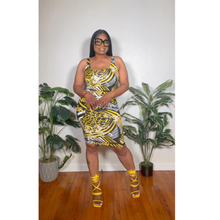 Load image into Gallery viewer, Detailed shot of floral midi dress waistline emphasizing feminine contour and stretch comfort.
