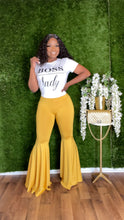 Load image into Gallery viewer, Mustard shiny HerWay bellbottom pants styled for evening outings with flared retro silhouette.
