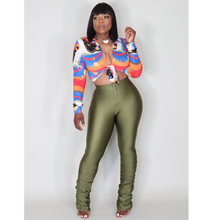 Load image into Gallery viewer, Olive stacked leggings styled in a trendy streetwear outfit with crop top and sneakers, showcasing versatility and fashion-forward appeal.
